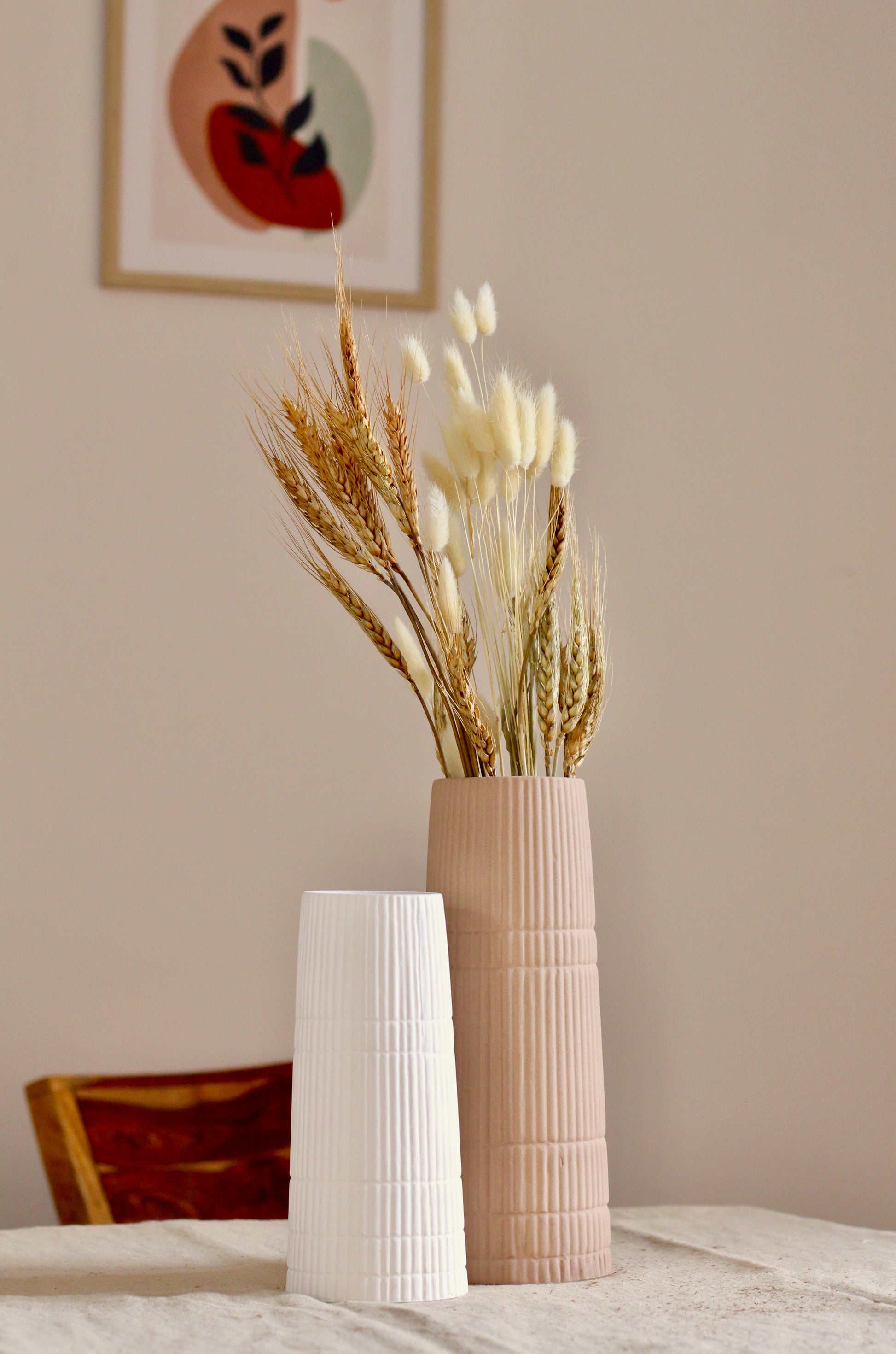 A photo with 2 vase set on a table